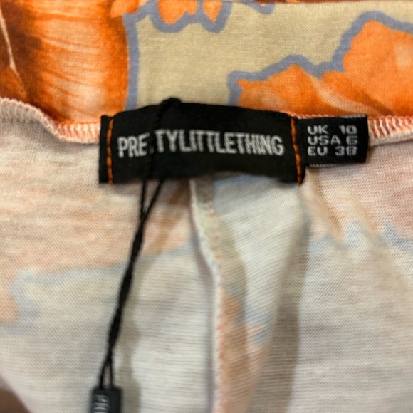 NWT- PrettyLittleThing orange floral print wide-leg pants. - Picture 6 of 8